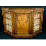 A Victorian gilt metal mounted walnut and marquetry shaped serpentine credenza, the top with matched