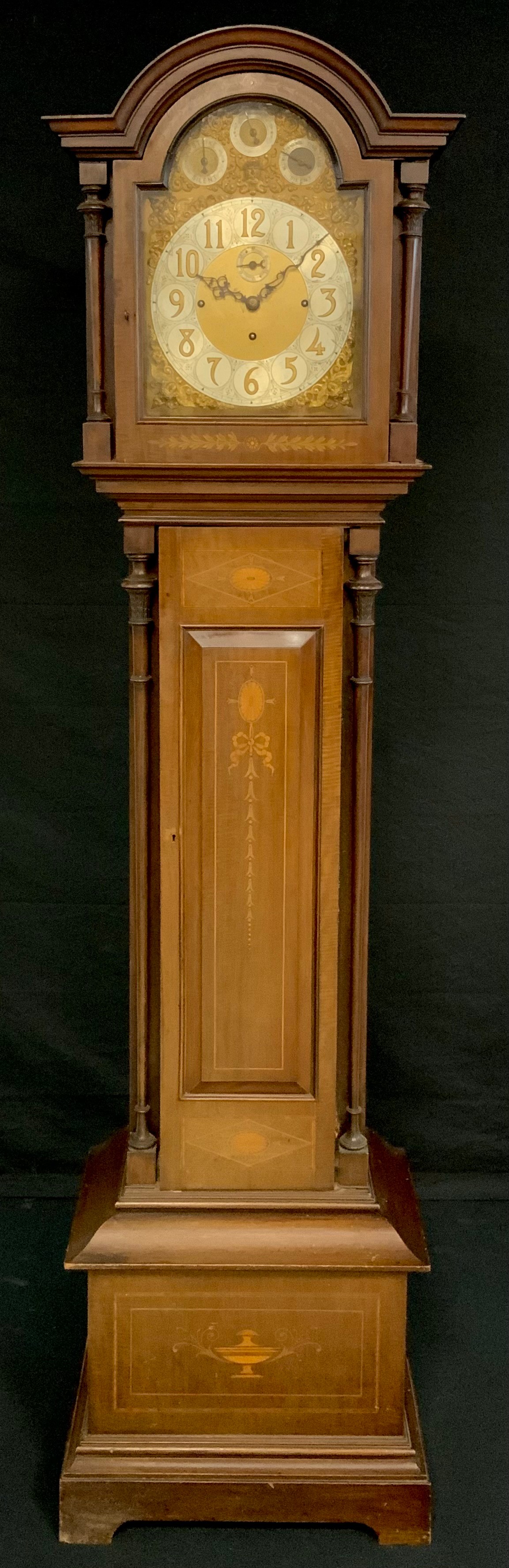 An Edwardian mahogany and marquetry musical longcase clock, 31cm arched brass dial with Arabic