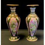 A Pair of 19th century French porcelain vases, painted with flowers on a pink ground, faint marks,