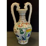 A modern Chinese dragon handled amphora vase, printed and painted with traditional warriors, dragons