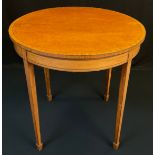 A Sheraton Revival satinwood centre table, retailed by S &H Jewell, of Holborn, circular top,