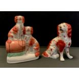 A 19th century Staffordshire spaniel, separate fore legs; similar flatback figure (2)