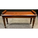 A Victorian style mahogany window seat, pillow-scroll ends applied with draught turned roundels,