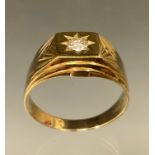 A Gentleman's diamond ring, round brilliant cut diamond approx 0.25ct, star set crest ,9ct gold