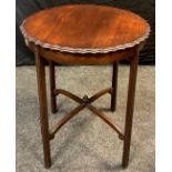 An Edwardian mahogany pie-crust edge occasional table, circular top, x-frame stretcher, 71.5cm