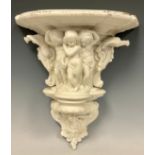 A Victorian Parian wall bracket, classically modelled with three cherubs, birds, fruiting vines