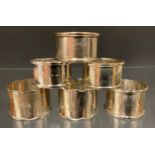 A pair of silver napkin rings, Birmingham 1918; another pair, 1923 etc, 93.6g gross (6)