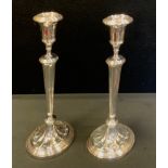 A pair of George III style table Epns candlesticks