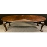 A Victorian mahogany oval extending dining table, large carved cabriole legs, ball and claw feet,