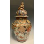 A large Japanese Imari octagonal jar and cover, Shishi finial, decorated blossoms, shishi and garden