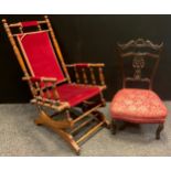A late 19th / early 20th century American rocking chair, 100cm high x 55cm wide; an Edwardian