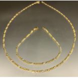 A Yellow metal curb link necklace and bracelet, both stamped 14, 55cm long, 18cm long, 9.6g