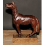 A hardwood carving, of a horse, in the manner of an artist’s lay model, oak base, 33cm high overall