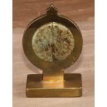 A 19th century brass pocket watch stand, incorporating a Chinese jade roundel, pierced and carved in