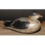 A painted softwood avian decoy, carved as a water fowl, 25cm long