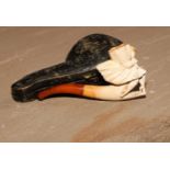 A late 19th century meerschaum pipe, carved as a lady of wearing a flowing skirt, 8.5cm long, cased