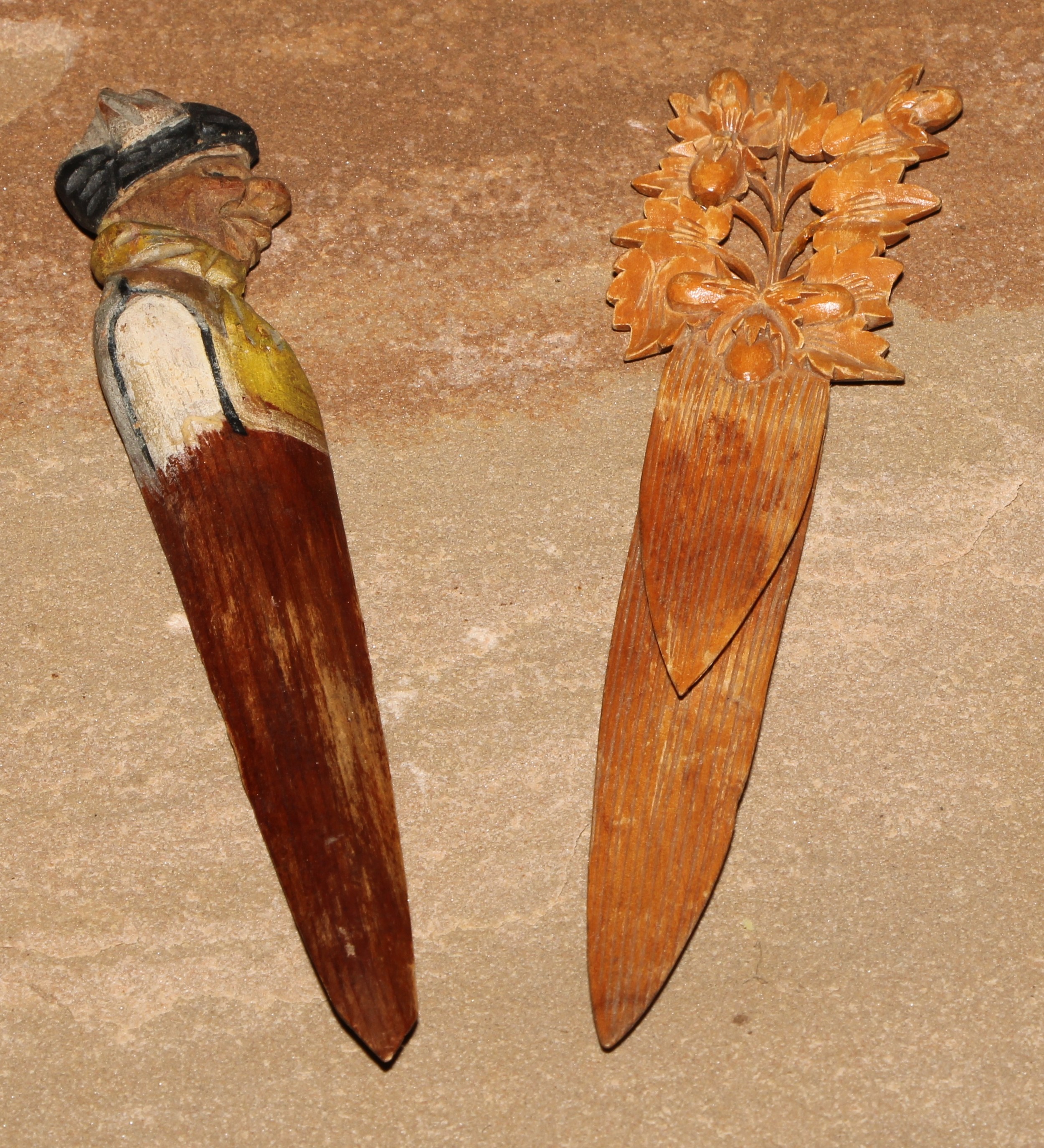 A Black Forest novelty figural bookmark, 13cm long, c.1900; another (2)