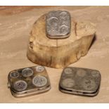 An early 20th century sprung five-section pocket coin holder, for 2/6 to 6d, 7cm wide; others (3)