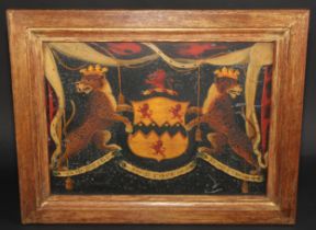 Heraldry - a George III carriage panel, painted in polychrome and gilt with the arms of Lord