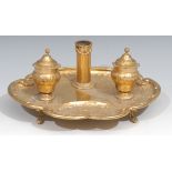 A Continental gilt copper shell shaped inkstand, scroll feet, 26cm wide, 19th century