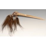 Tribal Art - a Papua New Guinea Cassowary bird bone dagger, embellished with feathers and knotted