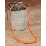 A coral bead necklace, 19.5cm drop