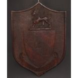 A 19th century oak armorial shield, carved in relief with the arms and motto of Urwick, 42.5cm x