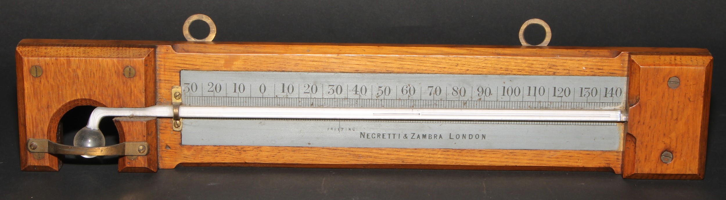 A Negretti & Zambra minimum self-registering thermometer, silvered register, oak mount, 35.5cm long - Image 2 of 3
