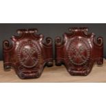 Heraldry - a pair of 19th century mahogany armorial cartouches, carved in relief with crossed