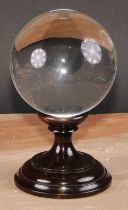 Mysticism and the Occult - a large crystal ball, turned stand, 23cm high overall