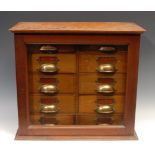 An Edwardian mahogany cabinet of apothecary or laboratory index filing drawers, by Flatters &