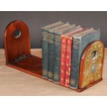 A Victorian walnut bookslide, arched folding end supports, each applied with gilt brass cut-card
