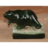 A Canadian Inuit nephrite jade carving, of a bear, rectangular base, 8.5cm high