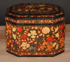 A Kashmiri canted rectangular box and cover, decorated overall in polychrome with a dense