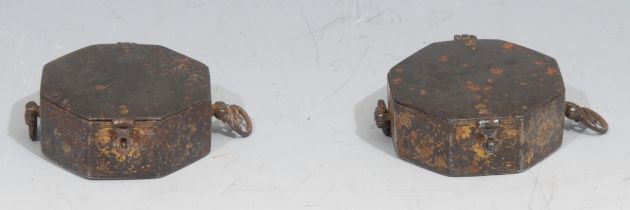 A pair of 18th century Indian octagonal gold inlaid steel Betel lime boxes, decorated with styalised