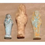 Antiquities - an Egyptian shabti, 15cm long; another, turquoise glaze; another (3)
