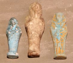 Antiquities - an Egyptian shabti, 15cm long; another, turquoise glaze; another (3)