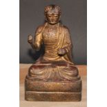 Chinese School, a bronze Buuddha, seated in meditation, traces of gilding, 24cm high