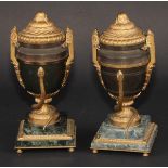 A pair of Neo-Classical Revival gilt and brown patinated bronze mantel urns, each two-handled