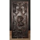 A 16th/17th century oak Romayne panel, carved in relief with a portrait bust, scrolls and strapwork,