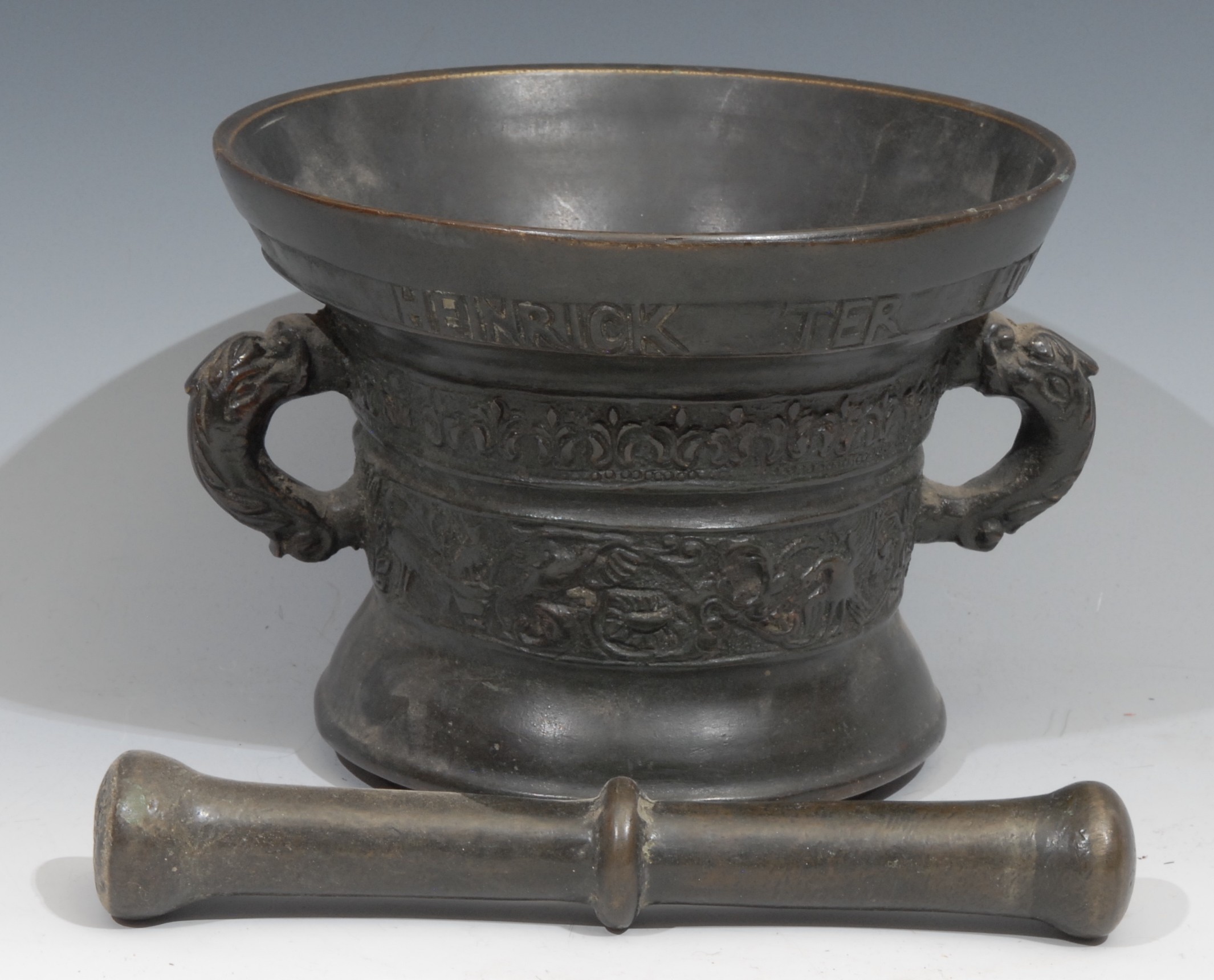 A Dutch bronze pestle and mortar, cast with birds and scrolling foliage, inscribed beneath the rim - Image 2 of 2
