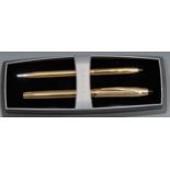 A Cross 18ct gold plated fountain pen and ball point pen set, the fountain pen with 18ct gold nib,