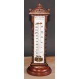 A large and unusual Victorian walnut table top thermometer, the opaque glass register inscribed Wood