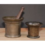An 18th century bronze pestle and mortar, flared rim, 12.5cm cm high, c.1760; another, smaller (2)