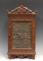 A 19th century Continental oak wall hanging hall cabinet, in the Renaissance Revival taste, shaped