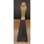 Antiquities - an Ancient Egyptian faience shabti, 9cm long, collector's display stand