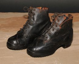 A pair of late 19th century leather child's leather boots, hobnail soles, 18cm long, c.1900