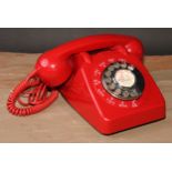A vintage GPO 706L telephone, red with chrome dial, 21cm long, c.1961