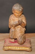 A Continental carving, in the Baroque taste as a young figure kneeling in prayer, giltwood and gesso