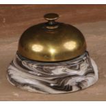 An early 20th century desk or counter bell, the Popular Bell, twist mechanism, marbled earthenware